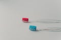 Two plastic toothbrushes for hygiene cavity mouth with lateral side isolated over white background. Dental concept