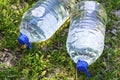 Two plastic water bottles on the grass. Royalty Free Stock Photo