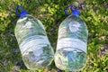 Two plastic water bottles on the grass. Royalty Free Stock Photo