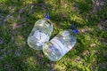 Two plastic water bottles on the grass. Royalty Free Stock Photo