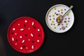 Two plates with of colorful pills, concept of correct use of medicines, different medicament, tablets, drugs, capsules for health