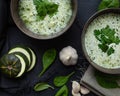 Two plates of green delicious cream soup.top view Royalty Free Stock Photo