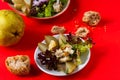 Rich vegetarian salad, bread and pear on red Royalty Free Stock Photo