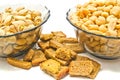 Two plates with tasty nuts and crackers Royalty Free Stock Photo