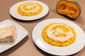 Two plates of traditional Italian Risotto with pumpkin and Gorgonzola cheese Royalty Free Stock Photo