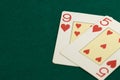 Two playing cards from the French deck on a green baize with copyspace Royalty Free Stock Photo