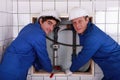 Two plumbers resting after work