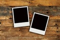 Two polaroids old grunge wooden wall texture Royalty Free Stock Photo