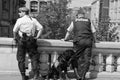 Two police men with a police dog obeying the demonstration in ZÃÂ¼rich city Royalty Free Stock Photo