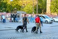 Two police officers with dogs patrolling popular tourist spot Sultanahmet square in Istanbul