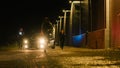 Two Police Officers in Pursuit of a Suspect. Cops Getting out of the Car Start Chasing Criminal on Royalty Free Stock Photo