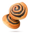 Two poppy seed buns flying on a white background. Isolated Royalty Free Stock Photo