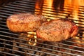 Two Pork Steak Close-up On The BBQ Flaming Grill