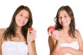 Two portraits of a cute smiling girl holding a red strawberry and an apple in her hand Royalty Free Stock Photo