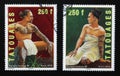 Two nice portraits of tattoed polinesian people on stamps Royalty Free Stock Photo