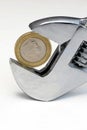 Two pound coin in wrench Royalty Free Stock Photo