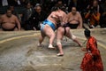 Two powerful men sumo wrestling