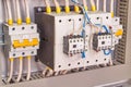 Two powerful power contactors and two circuit breakers in the electrical Cabinet