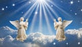 Two praying angels with rays of light over blue sky with stars with copy space in center Royalty Free Stock Photo