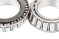 Two precision metal bearings on a white background. Close up Royalty Free Stock Photo