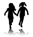 Two preschooler girls holding hands and running silhouettes Royalty Free Stock Photo