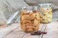 Two Preserved Pear Compote in Glass Jar on Wooden Table with Sta Royalty Free Stock Photo