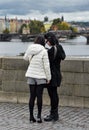 Two pretty Asian girls taking selfie and looks at the old city of Prague