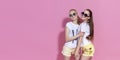 Studio lifestyle portrait of pretty two best friends sister girls, posing and having fun together at pink background Royalty Free Stock Photo