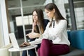 Two pretty Caucasian businesswomen working on their laptop Royalty Free Stock Photo