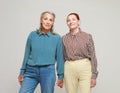 Two pretty old women friends on grey background. Royalty Free Stock Photo