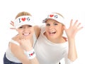 Two pretty football fan girls in funny hats