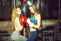 Two pretty girls boxers punching Royalty Free Stock Photo