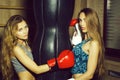 Two pretty girls boxers punching Royalty Free Stock Photo