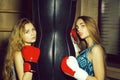 Two pretty girls boxers punching Royalty Free Stock Photo