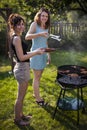 Two pretty girls making food