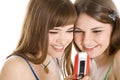 Two pretty girls reading SMS on mobile phone Royalty Free Stock Photo