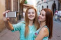 Two pretty girls taking selfie. Urban background. We love selfie Royalty Free Stock Photo