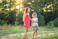 Two pretty little girls embracing and smiling at the countryside. Happy kids outdoors concept Royalty Free Stock Photo