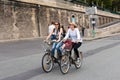 Two pretty Parisian girls who ride a bicycle