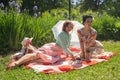 Two pretty pin up ladies having nice picnic in the city park in a sunny day together. girls friends enjoy hot summer weather. beau Royalty Free Stock Photo