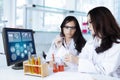 Two pretty scientists doing experiment Royalty Free Stock Photo