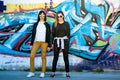 Graffiti Chic: Stylish Teen Girls Embrace Urban Beauty Royalty Free Stock Photo