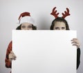 Two pretty women holding blank sign Royalty Free Stock Photo