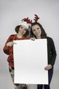 Two pretty women holding sign for copy space Royalty Free Stock Photo