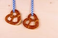 Two pretzel in heart shape on wood background Royalty Free Stock Photo