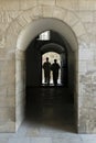 Two Priests in an Arched Passageway Royalty Free Stock Photo