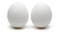 Two pristine white eggs showcased against a clean backdrop symbolizing simplicity and purity Royalty Free Stock Photo