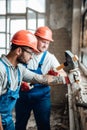 Two professional builders working together on a brick wall Royalty Free Stock Photo