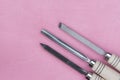 Two chisels on a pink background Royalty Free Stock Photo