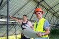 Two professional electrician checking installation at solar panels Royalty Free Stock Photo